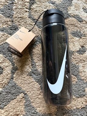 Nike Clear Water Bottle with White Swoosh and Black Lid